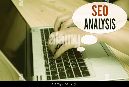 Word writing text Seo Analysis. Business photo showcasing tool helps showing to study on how to improve a website ranking woman laptop computer smartp Stock Photo