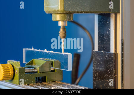 CNC  milling machine processes glass Stock Photo