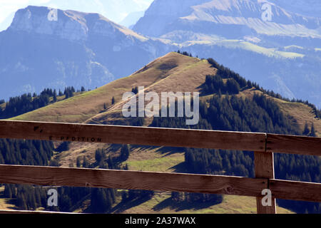 Panoramic landscape view of meadows, mountain ranges and snowy mountain peaks from the top of Rigi Kulm, Mount Rigi in Switzerland Stock Photo