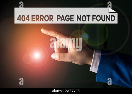 Writing note showing 404 Error Page Not Found. Business concept for Webpage on Server has been Removed or Moved Isolated hand pointing with finger. Bu Stock Photo