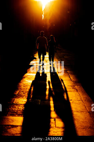 shadow of a young couple at golden hour in Barcelona Stock Photo