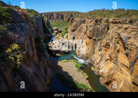 steep walls of red sandstone at bourkes luck potholes, mpumalanga, blyde river canyon, south africa Stock Photo