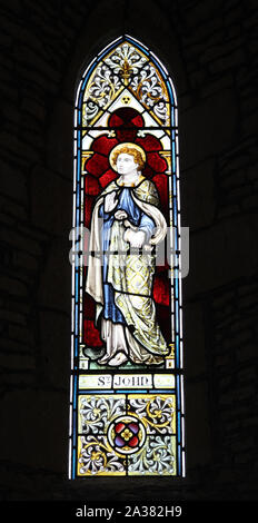 A stained glass window depicting St John The Evangelist, Whitchurch Church, Warwickshire Stock Photo