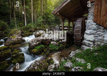 Wooden Mill at Creek by Gollinger Waterfall in Austria. Autumn Season. Long Exposure Photo. Stock Photo