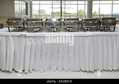 Food Warmers Trays Ready at Buffet Table Stock Photo