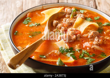 Homemade thick lasagna soup with minced meat closeup in a plate. horizontal Stock Photo