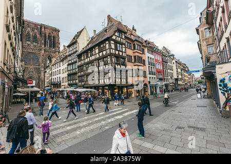 Strasbourg, France - July 26, 2017. Tourists walk along the street of Strasbourg near the cathedral Stock Photo