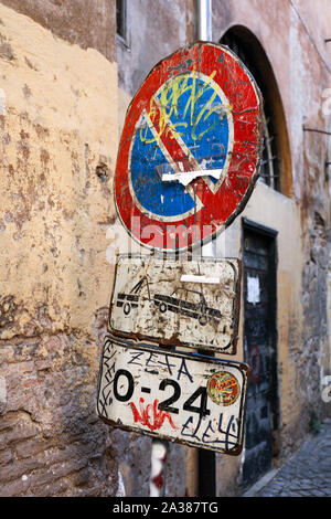 Scuffed up old no parking -sign in Trastevere, Rome, Italy. Stock Photo