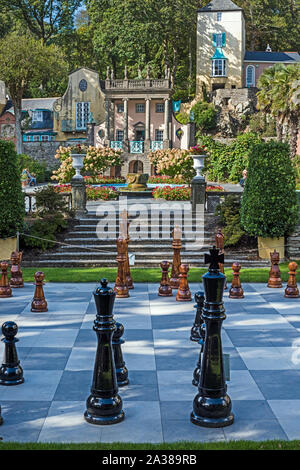 Colourful architecture on the hillside of Portmeirion Village, Wales with painted buildings and apartments in Italian Style. Stock Photo