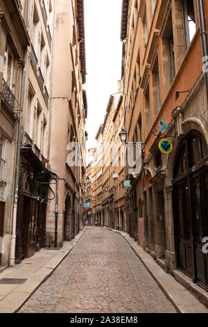 Beautiful old buildings house shops and restaurants on the Rue des Trois-Maries in the Vieux Lyon quarter of Lyon, France. Stock Photo