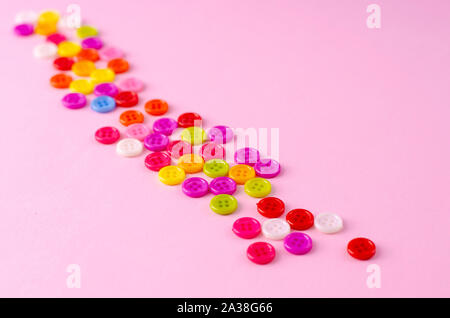 Many colorful buttons on blue background. Selective focus. Copy space Stock Photo