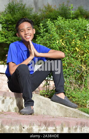 An A Handsome Boy Praying Stock Photo