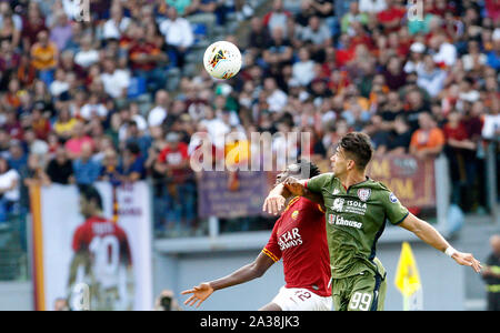 Rome, Italy, 06th October, 2019. Roma's Amadou Diawara, left, and Cagliari's Luca Pellegrini fight for the ball during the Serie A soccer match between Roma and Cagliari at the Olympic Stadium. Credit: Update Images/Alamy Live News Stock Photo