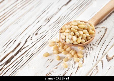 cedar nuts in spoon Stock Photo