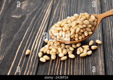 cedar nuts in spoon Stock Photo
