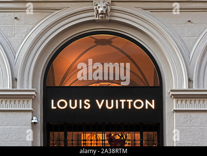 Louis Vuitton store entrance. Louis Vuitton brand logo logotype.Louis  Vuitton Malletier French luxury fashion house Stock Photo