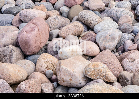 Many colorful stones on the beach background Stock Photo