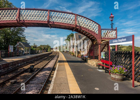 Looking down the platform and railway tracks of Kirkby Stephen on a beautiful summer's day, Yorkshire Dales Stock Photo