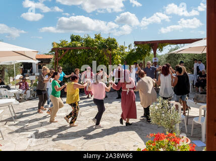 Cypriot dancers performing in traditional costumes at the Oleastro Olive Festival, Anogyra, Cyprus. Stock Photo