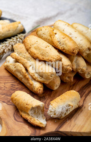 Small italian bread rolls crostini made from wheat dough with sesame close up Stock Photo