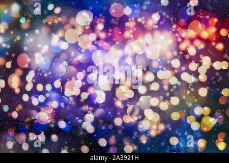 Sparse snowfall Christmas background. Subtle flying snow flakes and stars on dark blue night background. Beauteous winter silver snowflake overlay tem Stock Photo