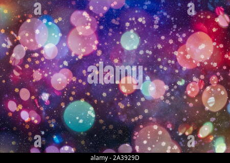 Sparse snowfall Christmas background. Subtle flying snow flakes and stars on dark blue night background. Beauteous winter silver snowflake overlay tem Stock Photo
