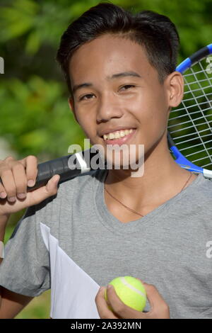 Smiling Fit Male Tennis Player With Tennis Racket Stock Photo