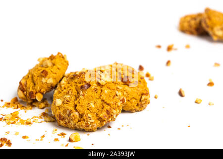 Integral cookies with almonds and hazelnuts isolated on white Stock Photo