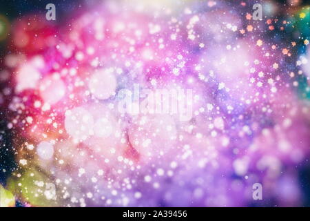 Flying snowflakes on a light blue background. Winter Abstract snowflakes. Falling snow. Stock Photo