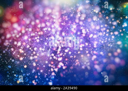 Flying snowflakes on a light blue background. Winter Abstract snowflakes. Falling snow. Stock Photo