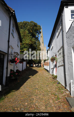 Stoney Lane, Thaxted, Essex, is a narrow cobbled street leading beside the Guildhall up to the parish church, providing a marvellous view of the tower Stock Photo