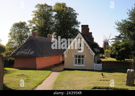 The Almshouses, Thaxted, Essex, stand in the churchyard providing a marvellous view to John Webb’s Windmill. Stock Photo