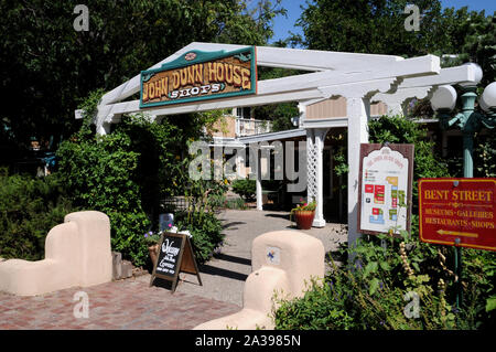 Entrance to the John Dunn shops near the historic plaza in Taos, New Mexico. The shops are named after Long John Dunn, local character and legend.. Stock Photo