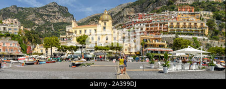 POSITANO, ITALY - AUGUST 2019: Panoramic view of the town of Positano from the beach. Stock Photo