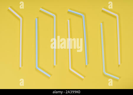 Background for a banner with plastic tubes isolated on yellow background. Frame for a banner with cocktail tubes. Party banner, cocktails bar. Elegant Stock Photo