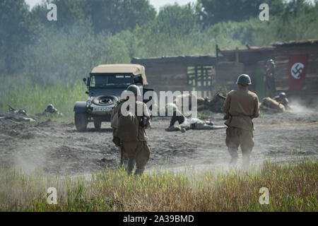 Battle of the Soviet Army with the German Army during historical staging. Military Vehicles Rally 'Operation Tempest' in Trzebinia, Poland Stock Photo