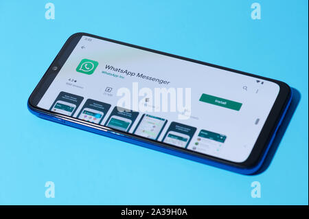 New york, USA - september 28, 2019:Installing mobile whatsapp app on smartphone screen close up view Stock Photo