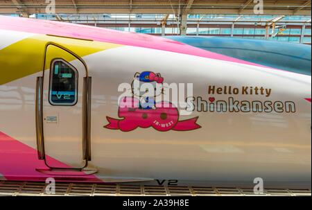 Hello Kitty advertising on high speed train Shinkansen on platform, station, Hiroshima, Japan Stock Photo