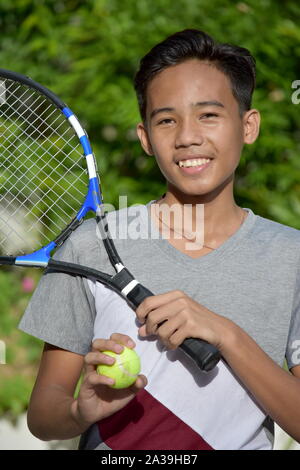 Teenage Athlete Tennis Player And Happiness With Tennis Racket Stock Photo