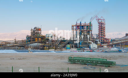 Dead Sea, Israel - June  2019: Mineral extraction plant on the shores of the Dead Sea Stock Photo