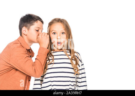 boy telling secret to surprised friend isolated on white Stock Photo