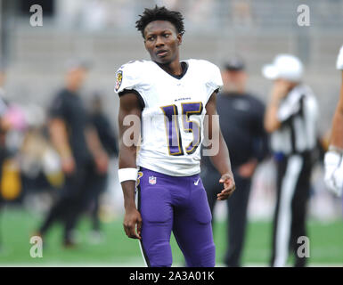 DETROIT, MI - SEPTEMBER 26: Baltimore Ravens wide receiver Marquise Brown  (5) cannot hold on to a pass in the end zone while Detroit Lions running  back Bobby Price (27) defends during