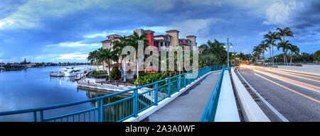 Dark clouds over Herbert R. Savage bridge, over Savage Pass, at the entrance of Marco Island, Naples, Florida Stock Photo