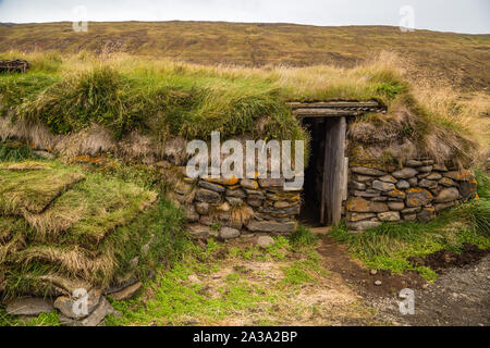 Icelandic turf house has thick walls of stone, wood and sod to insulate harsh climate in Iceland Stock Photo