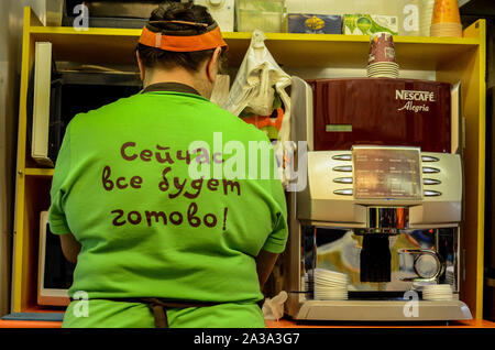Tambov, Tambov region, Russia. 7th Oct, 2019. Fast food and coffee saleswoman. The inscription on the shirt-now everything will be ready Credit: Demian Stringer/ZUMA Wire/Alamy Live News Stock Photo
