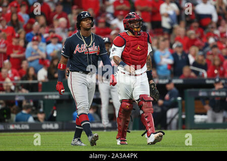 St. Louis, United States. 06th Oct, 2019. St. Louis Cardinals catcher Yadier Molina walks with Atlanta Braves Ronald Acuna, Jr. to first base after Acuna was almost hit by a pitch in the ninth inning og Game 3 of the National League Division Game at Busch Stadium in St. Louis on Sunday, October 6, 2019. Atlanta defeated St. Louis 3-1. Photo by Bill Greenblatt/UPI Credit: UPI/Alamy Live News Stock Photo