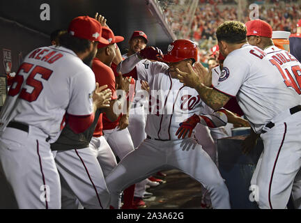 Washington, United States. 06th Oct, 2019. Washington Nationals Juan Soto (22) celebrates his two-run home run in the dugout against the Los Angeles Dodgers in the first inning during the National League Division Game Three at Nationals Park in Washington, DC on October 6, 2019. Washington and Los Angeles enter game three tied 1-1 in the five-game series. Photo by Kevin Dietsch/UPI Credit: UPI/Alamy Live News Stock Photo