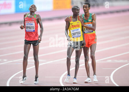 Joshua Cheptegei (Uganda, gold medal), Yomif Kejelcha (Ehtiopia, silver medal), Rhonex Kipruto (Kenya, bronze medal). 10000 Metres men final. IAAF World Athletics Championships, Doha 2019 Stock Photo