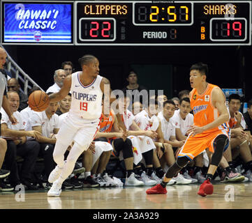 Honolulu, Hawaii. October 6, 2019 - Los Angeles Clippers guard Rodney McGruder #19 looks to pass as Shanghai Sharks forward Cai Liang #1 defends during a preseason game between the Los Angeles Clippers and the Shanghai Sharks at the Stan Sheriff Center on the campus of the University of Hawaii at Manoa in Honolulu, HI - Michael Sullivan/CSM. Stock Photo