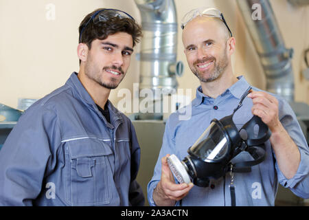 workers in blue work suit Stock Photo
